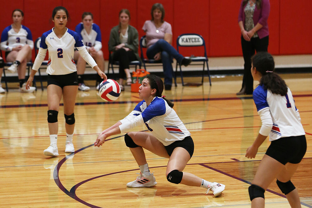 Arlette Ortega-Chavez digs a hit during the third set against Kaycee